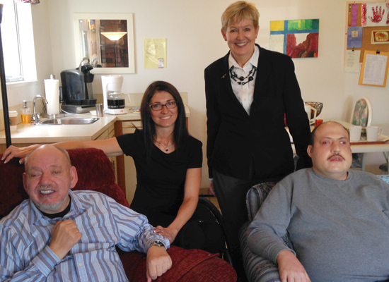 Michelle Stilwell, Minister of Social Development and Social Innovation, and Suzanne Anton, Minister of Justice and MLA for Vancouver-Fraserview, visit Woodvan residents Jeffrey Dolynski and Brian Medeiros.